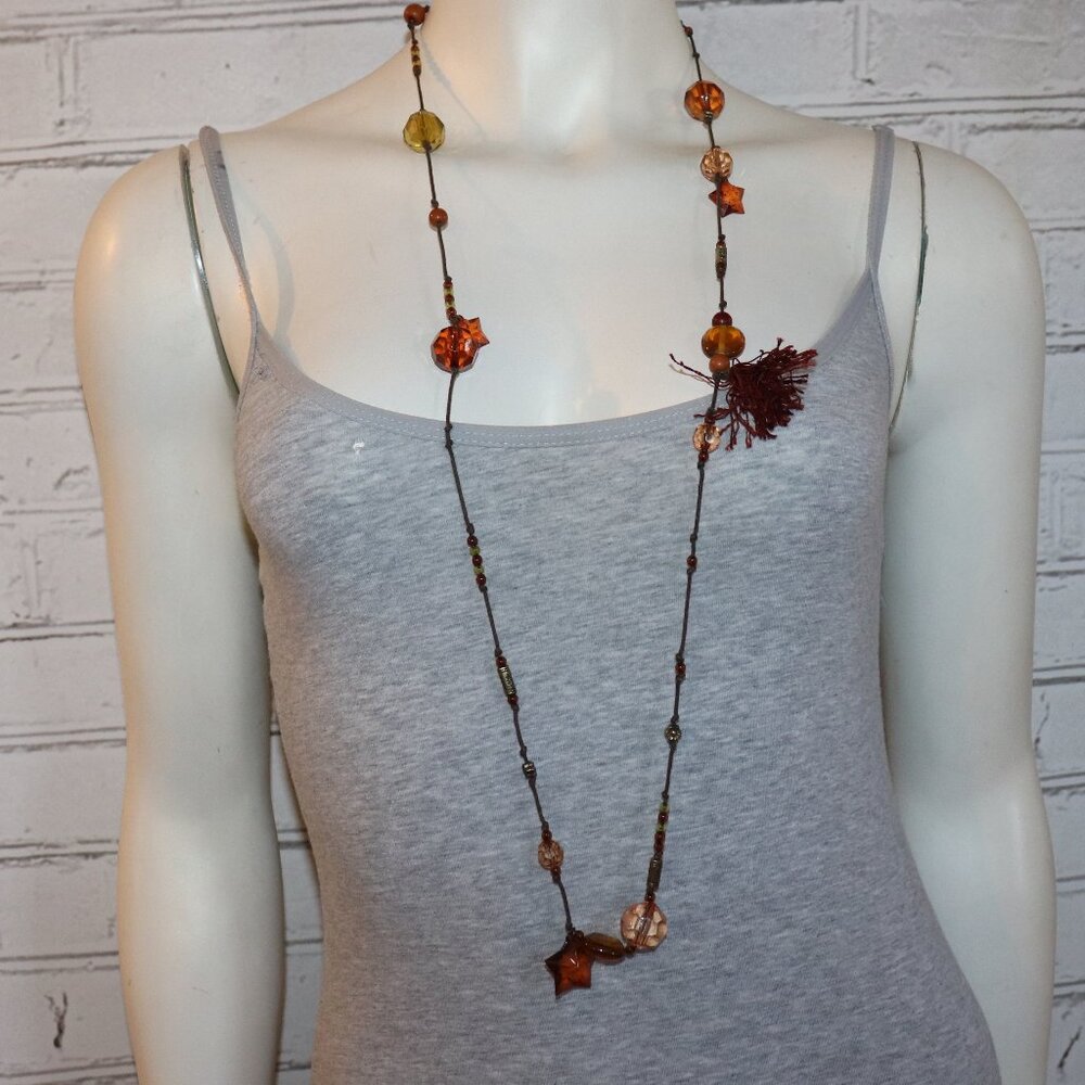 Brown cord necklace with brown and orange charms 21" long